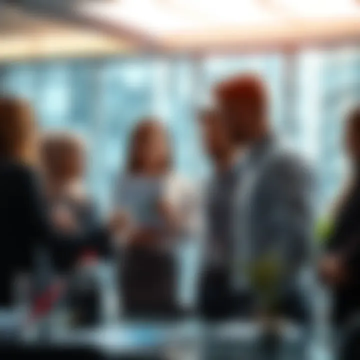 A group of people discussing economic data and graphs in a modern office setting