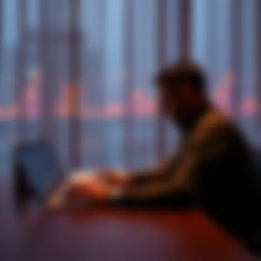 A man sits alone at a table, staring at his laptop displaying a Bitcoin trading chart, reflecting sadness and regret over lost love.