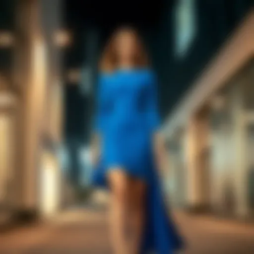 Young woman wearing a stylish blue dress in an urban setting, showcasing a modern fashion trend.