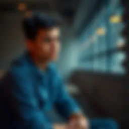 A 20-year-old man sitting alone with a pensive expression, symbolizing struggles with relationships.